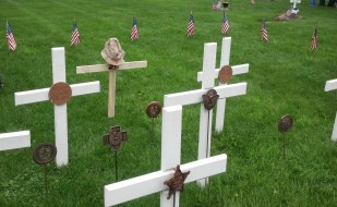 crosses at cemetery on Memorial Day