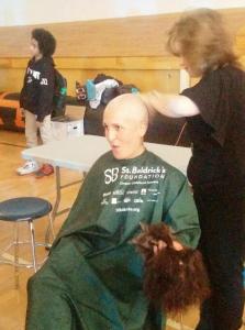 check out the hair she is holding in her hand to be donated!